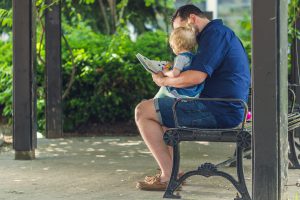 Dad reading with daughter